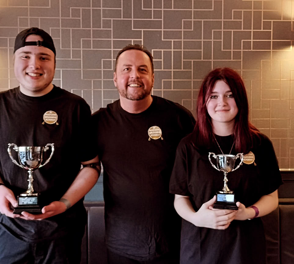 Photo of a Child with Curly Hair Playing the Drums while Her Eyes are Closed