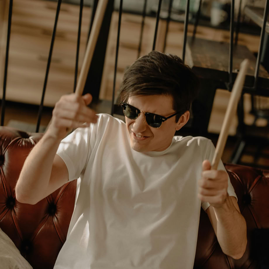 Woman in White Crew Neck T-shirt Wearing Black Sunglasses